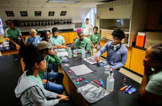 Robeson High School students around a lab table at CCCEC