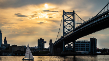Delaware River with ben Franklin bridge and sailboat