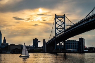 Delaware River with ben Franklin bridge and sailboat